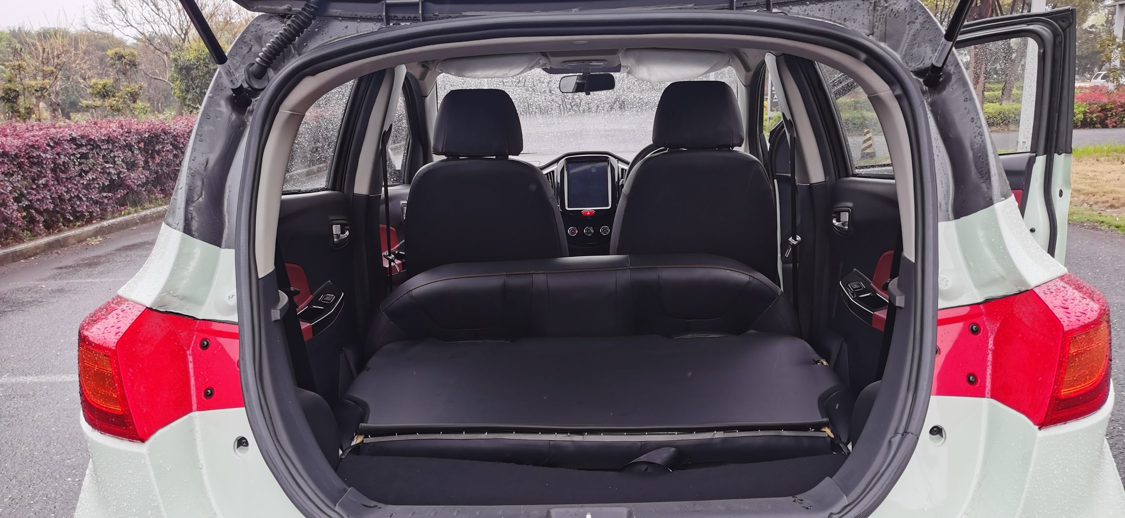 The boot of the D01 with the rear bench folded down to a flat floor