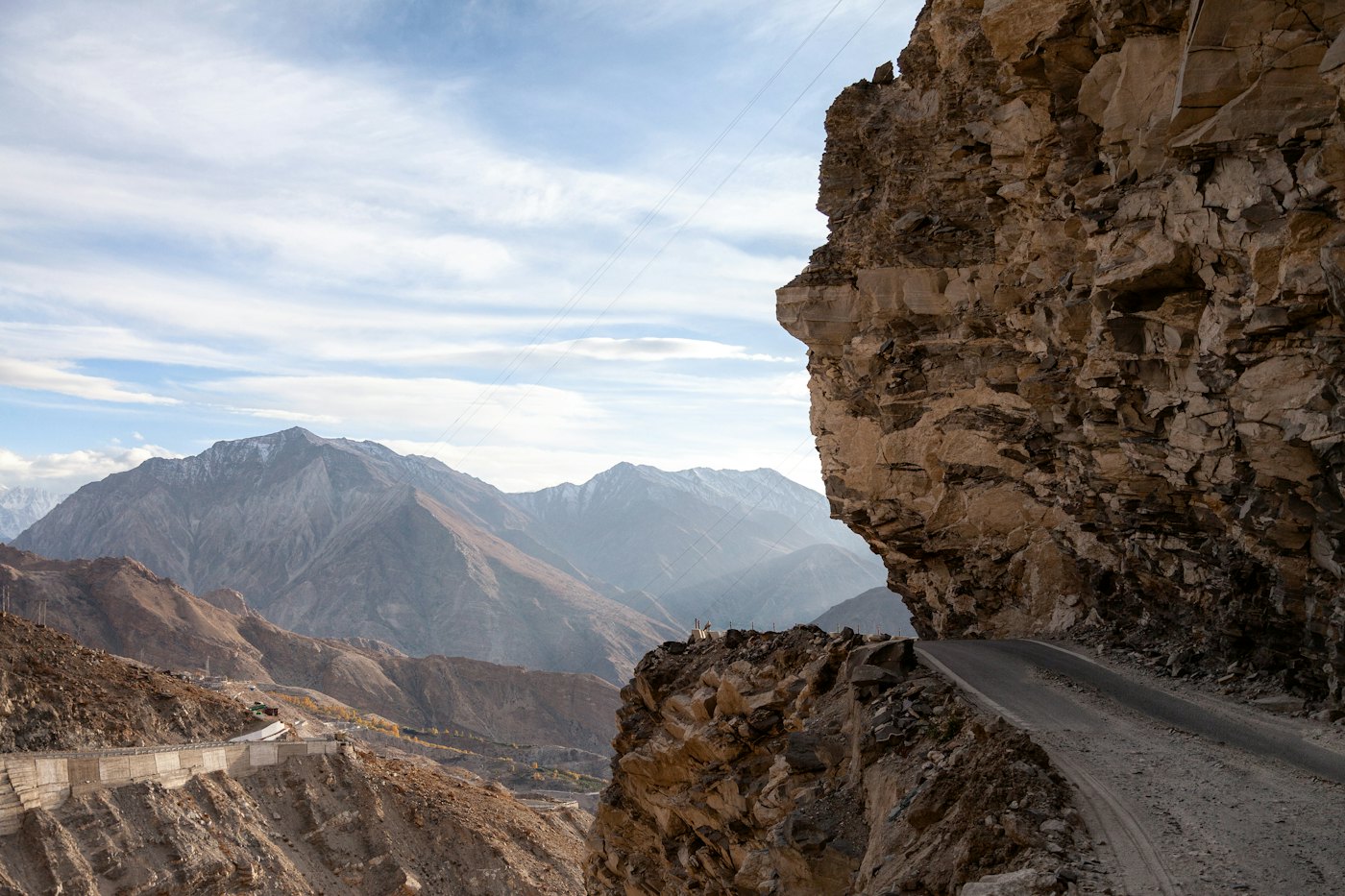 A road switchbacking up a steep mountainside, seen from above