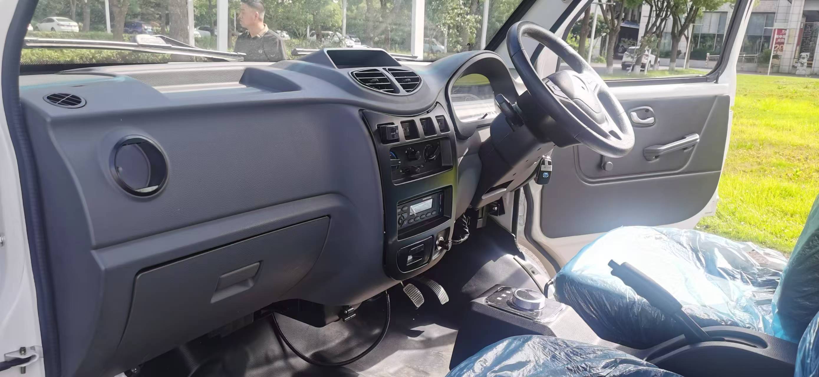 The instrument panel, steering wheel and centre controls of the KF1 EV